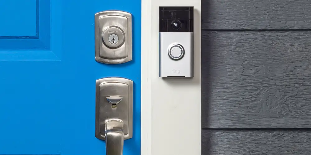 RING video doorbell on an apartment with blue door
