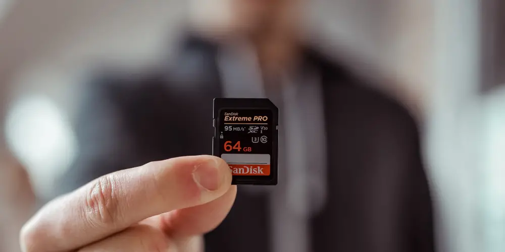 a man holding a memory card