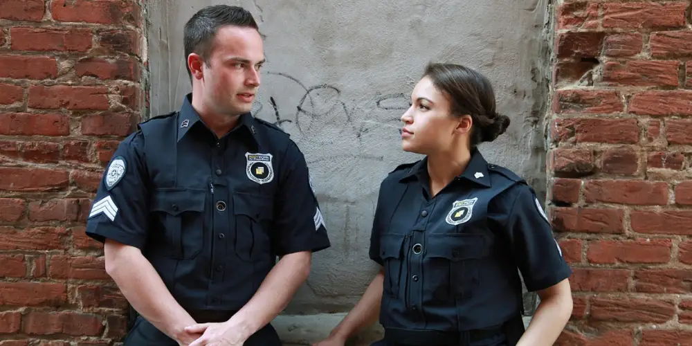a man and woman police officer talking