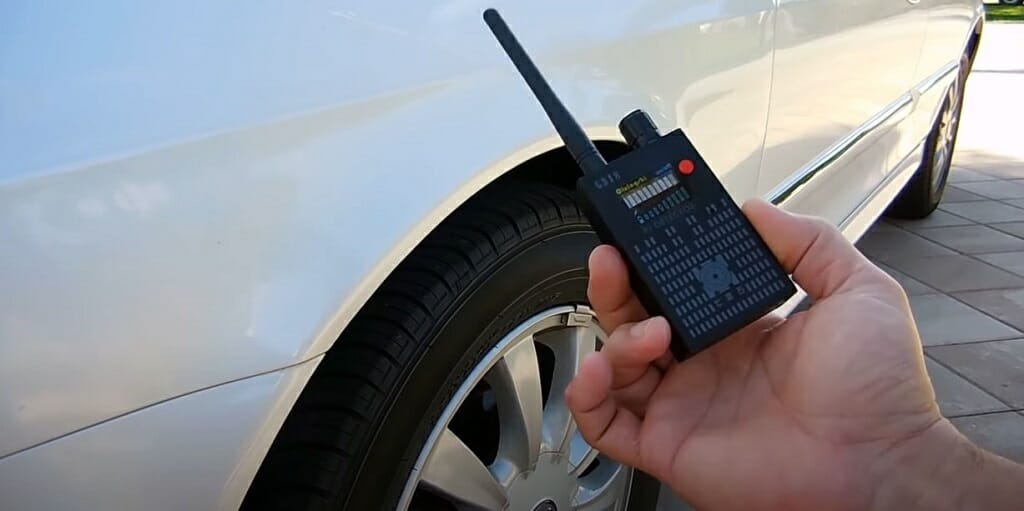 right hand holding a bug detector device